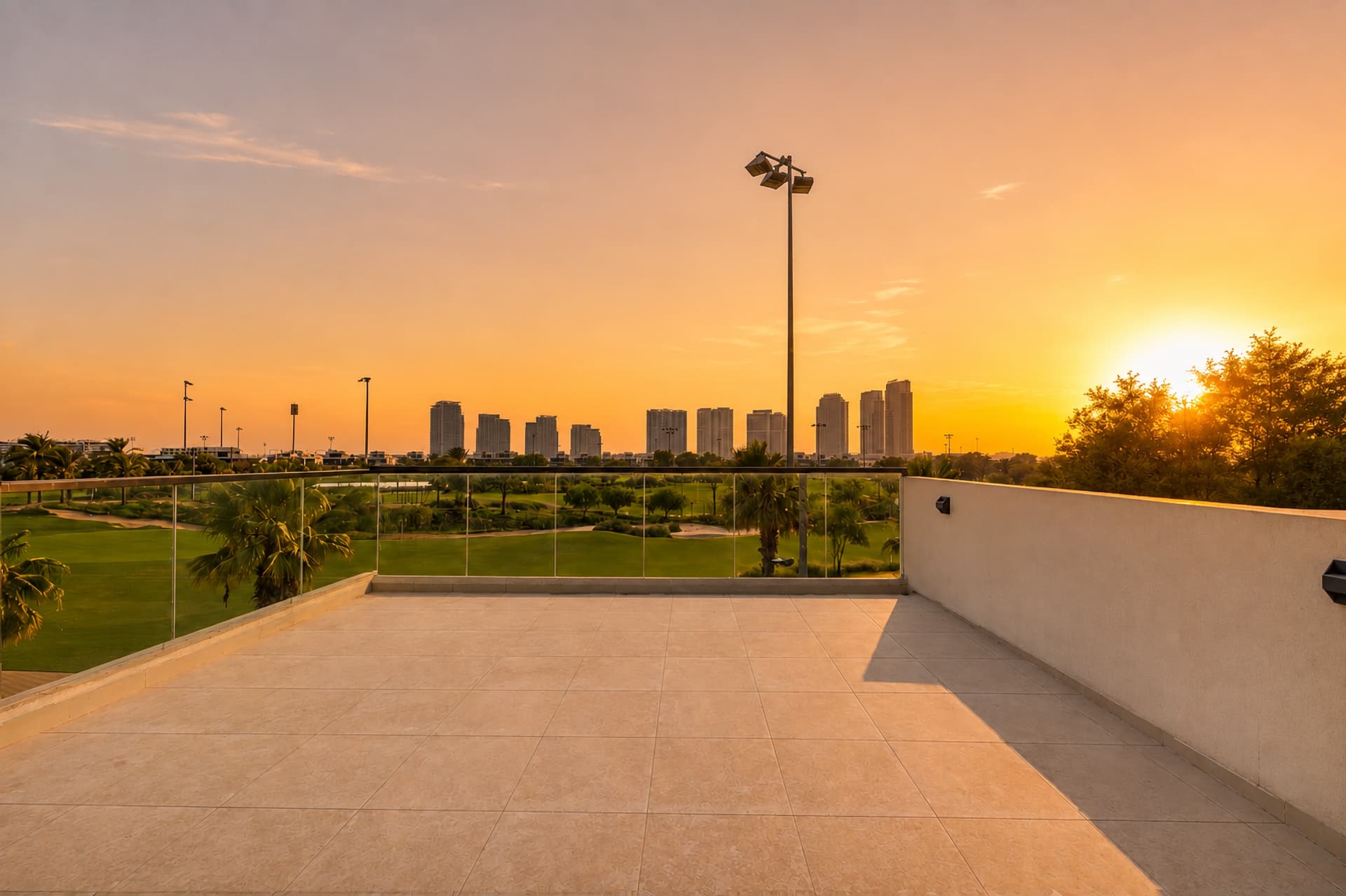 The roof terrace of The Golf House at sunset, unfurnished